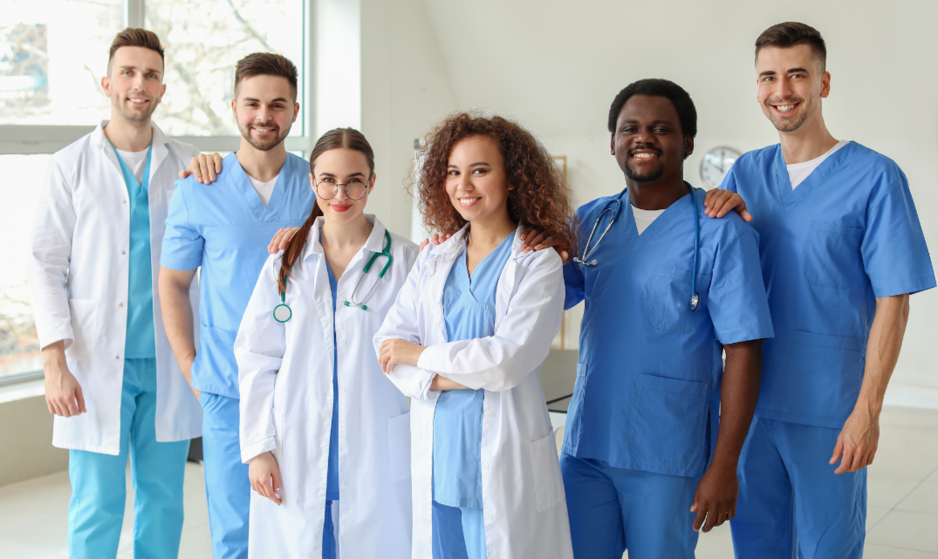Group of health professionals standing proudly