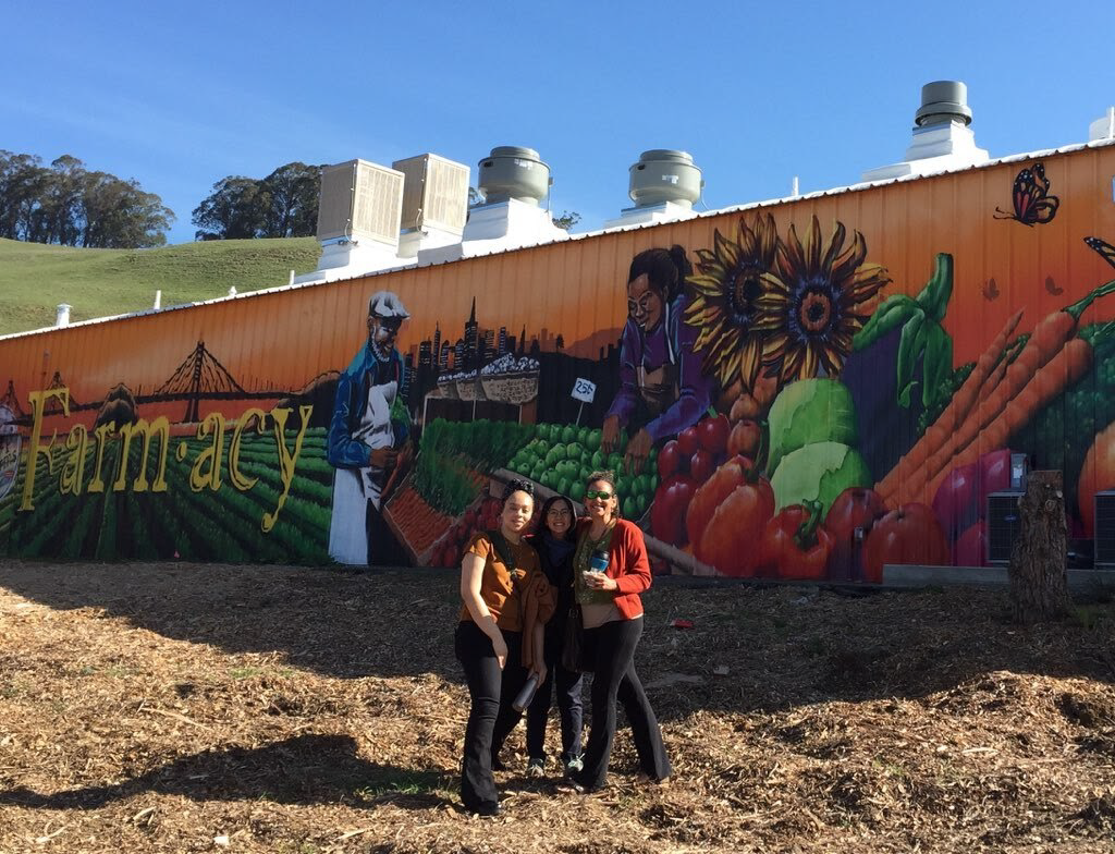 Anchors in Resilient Communities staff stand in front of the new Dig Deep Farms commercial kitchen facility in Alameda County. (Lucia Sayre/Health Care Without Harm)