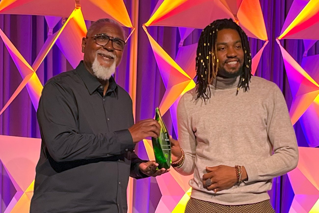 Michael Collins (left) receives the Charlotte Brody Award from Jeremiah Headen, U.S. climate and health campaigner with Health Care Without Harm at the 2024 CleanMed conference in Salt Lake City on May 21, 2024