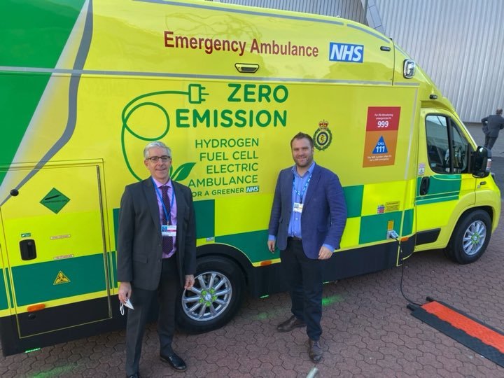 John Balbus views a zero-emission ambulance with NHS