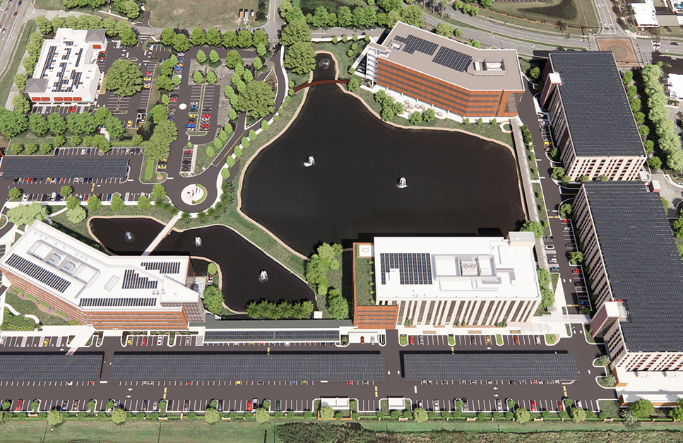 Areal view of AdventHealth campus with solar rooftop arrays featuring over 7,500 solar panels. The system will encompass four building rooftops, two parking garages, and multiple solar canopies throughout the surface parking lot.