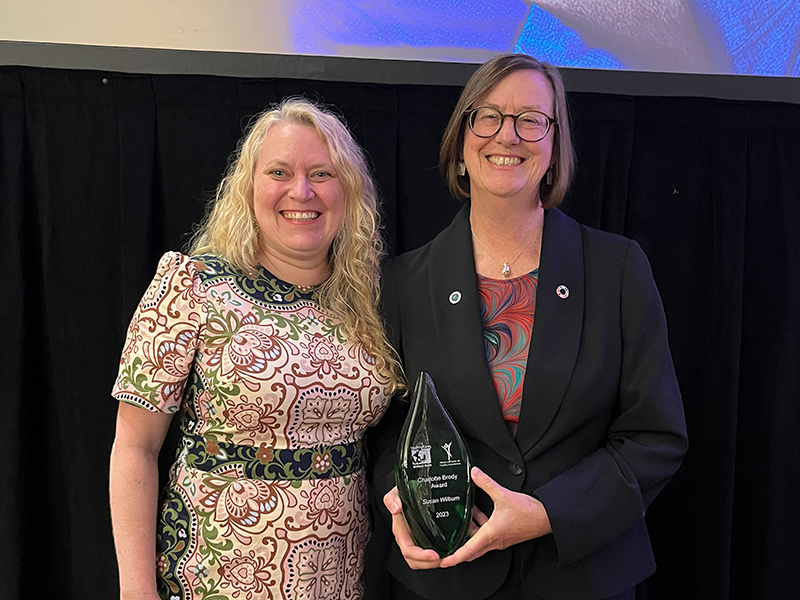 Sarah Wilburn poses with the Charlotte Brody Award